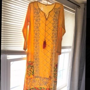 Women’s Yellow Pakistani Shalwaar Kameez.